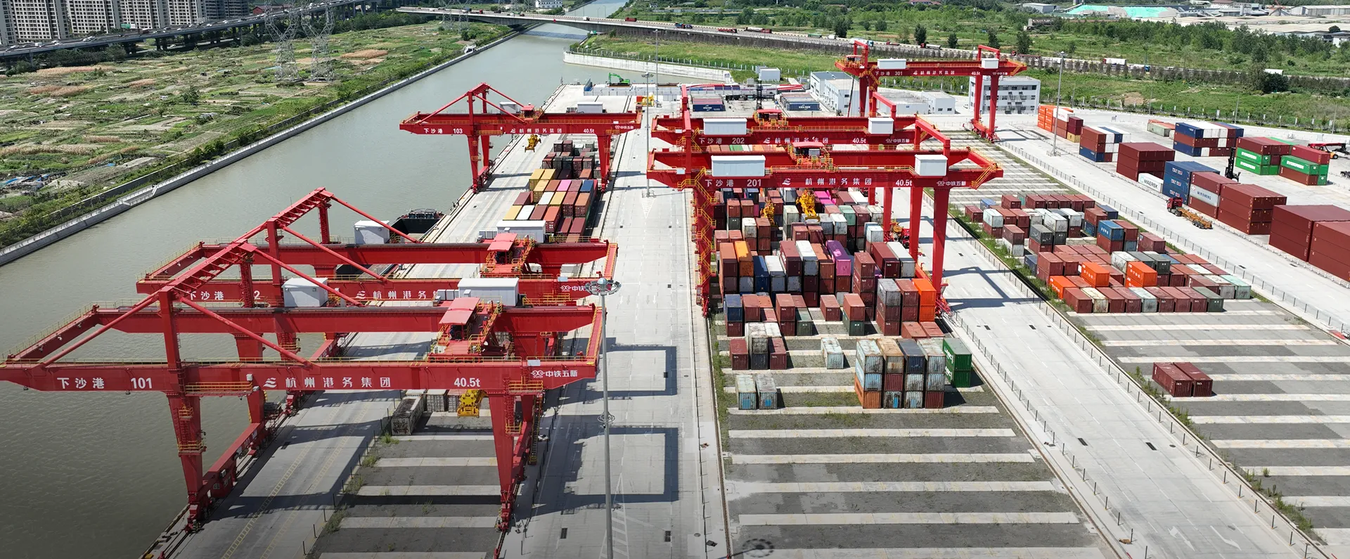 Container terminal with rows of red gantry cranes for inland ports