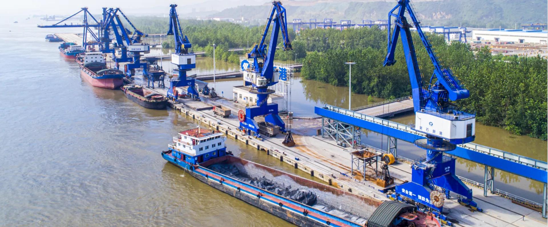 Large red cargo-handling crane for freight yards