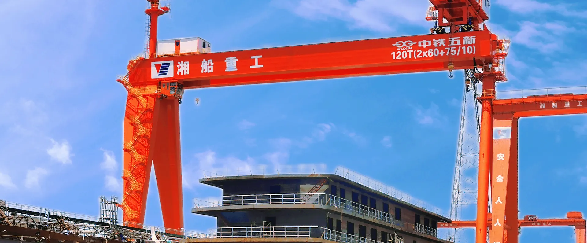 Container terminal with rows of red gantry cranes for shipyards