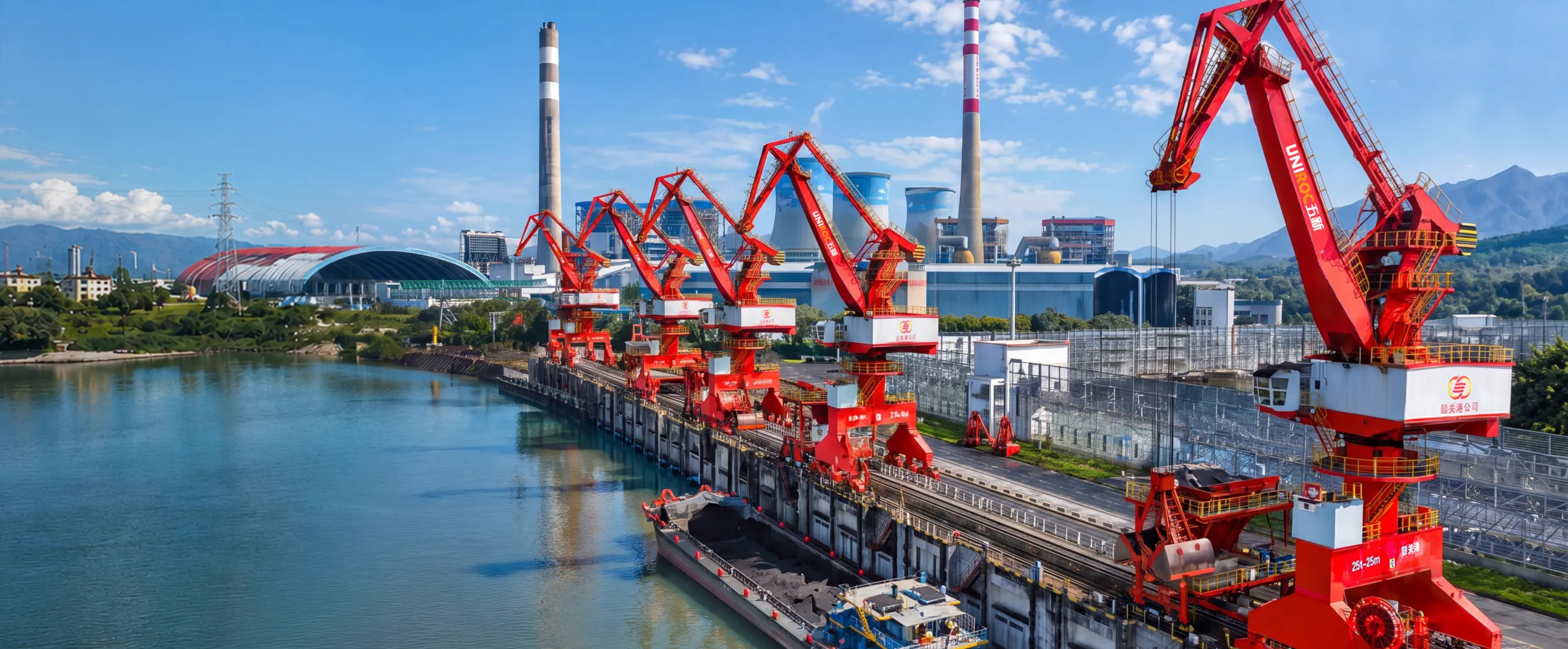 Integrated cargo handling cranes at a coastal port